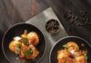 Vegetable Sauté with Ravioli Three plates of ravioli on a black background