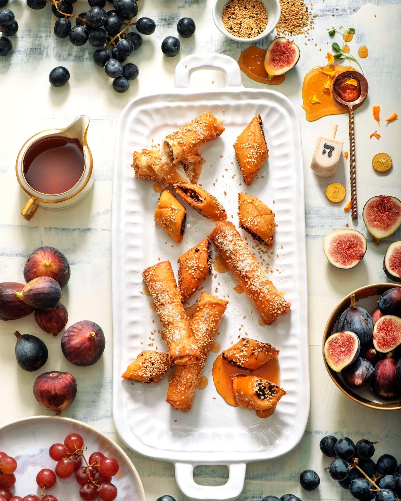 A delectable assortment of Maqrut and Neulas Encanonadas pastries, popular traditional treats from a Mediterranean culinary tradition.