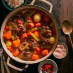 Pepper Pot Stew featuring peppers, spices, beef tripe, and leafy greens.