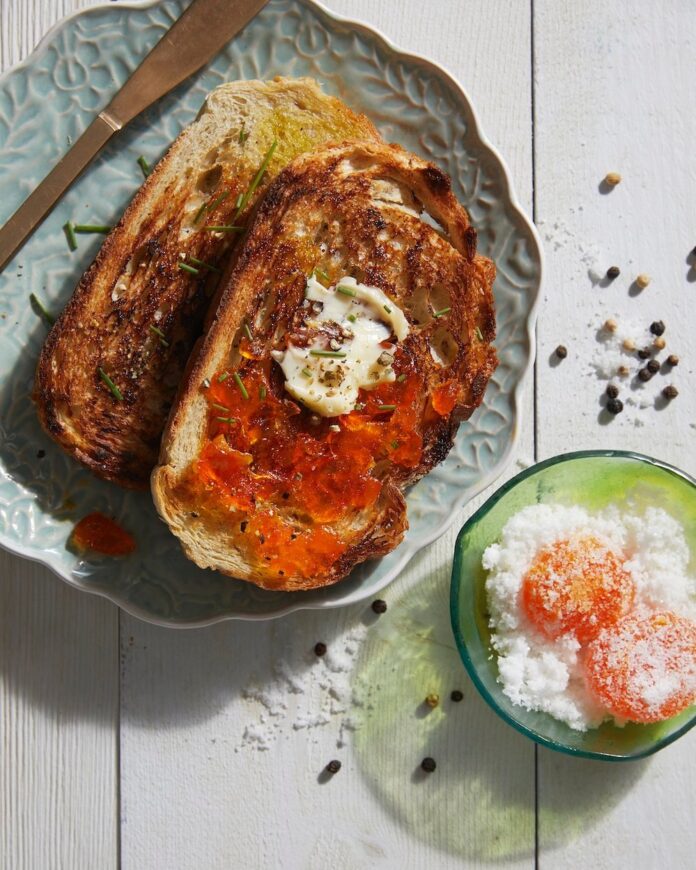bright orange cured egg yolk on toast