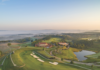 Spring Travel Guide 2023 An aerial view of Nemacolin's golf course.