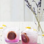 a gin cocktail with a dash of purple