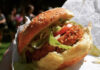 4 Meatlessly Marvelous Pittsburgh Picks a vegan sandwich that looks like fried chicken with lettuce and tomatoes between 2 burger buns, meatless veggie dish