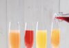 Sip Around Gluten Intolerance at 3 Pittsburgh Area Hot Spots 4 champagne glasses with an orange a red a yellow and a peach colored mimosa