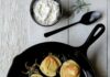 Pierogies, Where to Get the Quintessential Pittsburgh Food five pierogis in a black iron skillet on a white table