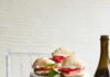 Watermelon Sandwiches Three Watermelon Sandwiches served on a heightened plate. Two sandwiches served on two smaller plates on the side.