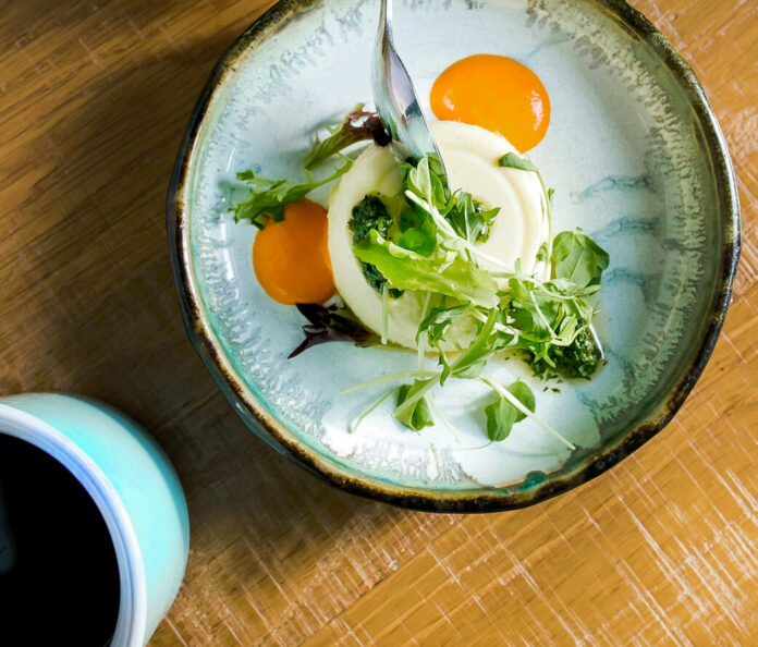 Corn Flan Recipe An aerial shot of a creamy bowl of corn flan, egg yolks and thyme sit on top. Corn Flan Recipe