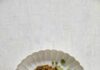 Green Pea Gluten Free-Pasta with Sunflower Seed Pesto Green Pea Pasta with Sunflower Seed Pesto served in a while ceramic plate on a whitish rough surface