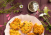 Sweet Potato and Corn Fritters An aerial view of seven Sweet Potato and Corn Fritters on an a white plate, surrounded by herbs. Corn Fritters recipe. Vegetable fritter