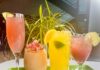 Conroy Foods Shares Pittsburgh Music Through QR codes 4 cocktails on a green tray with a plant behind them sitting on a white table