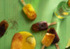 Paleta Popsicles Various dark red and orange colored fruit popsicles sit on green wood. Paleta Popsicles Recipe