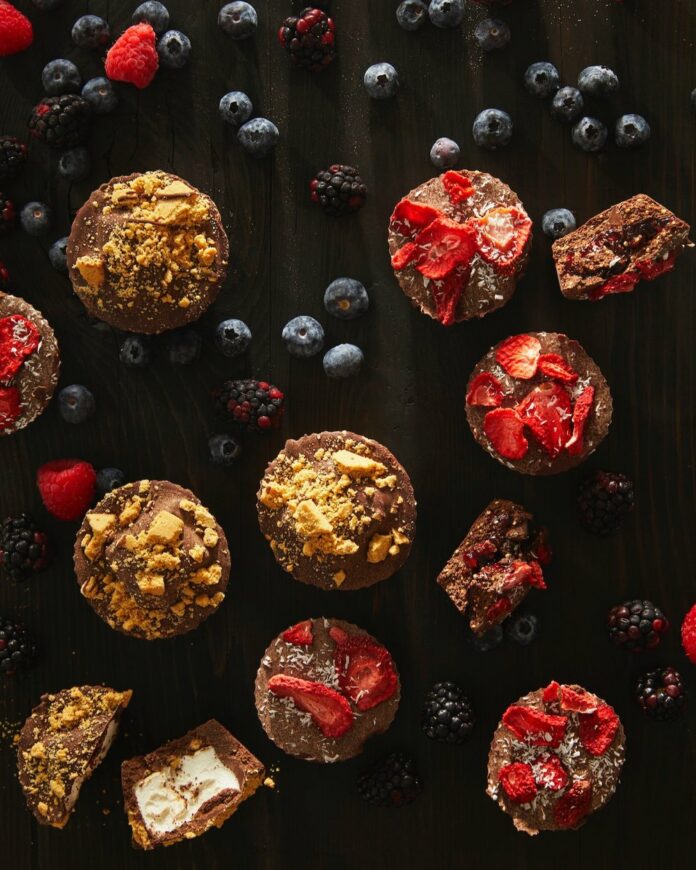 Allergen-Free Chocolate Treats served with berries on top of a wooden surface