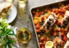 Easy Sheet Pan Dinners A vibrant and nutritious pan salmon and tomato meal featuring perfectly roasted salmon fillets accompanied by a colorful assortment of ripe tomatoes.