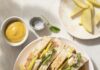 10 Quick Lunches for Kids A turkey and apple sandwich side up on a white plate next to chips.