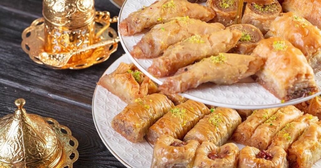 Fried eggrolls on white platters.