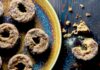 Keto Pumpkin Donuts An aerial view of six keto pumpkin donuts sit on three plates