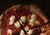 Feed Your Soul: Expert Recommended Pittsburgh Food Spots a sliced round pizza with red sauce and mozzarella balls