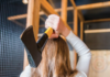 7 Indoor Activities to Stay Busy During the Pittsburgh Winter A women throwing an axe at an axe throwing bar. Indoor Activities Pittsburgh