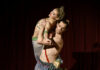 The Pittsburgh Ballet Theatre Debuts The Nutcracker A male dancer lifts a female dancer into the air against his body on a stage.