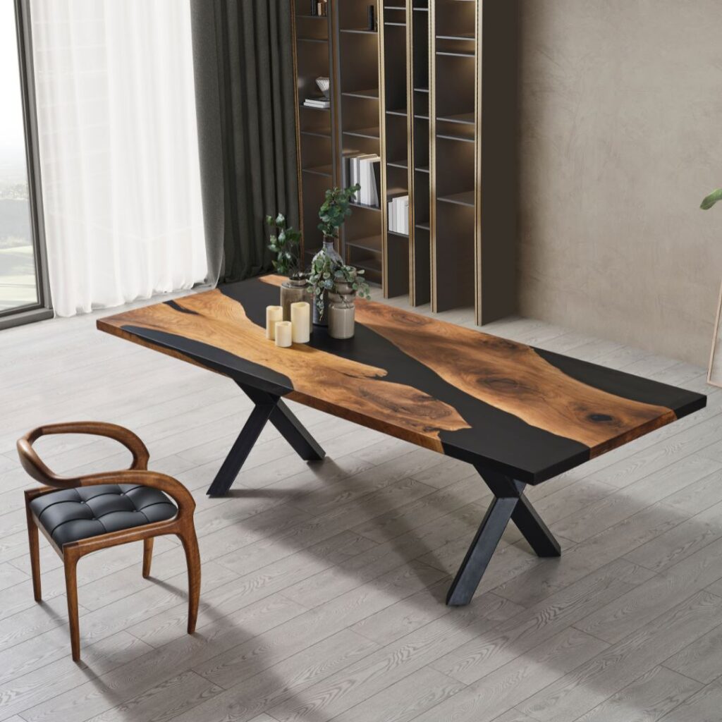 A black and wood table sits in the middle of a grey room with a modern chair sitting in front of it.