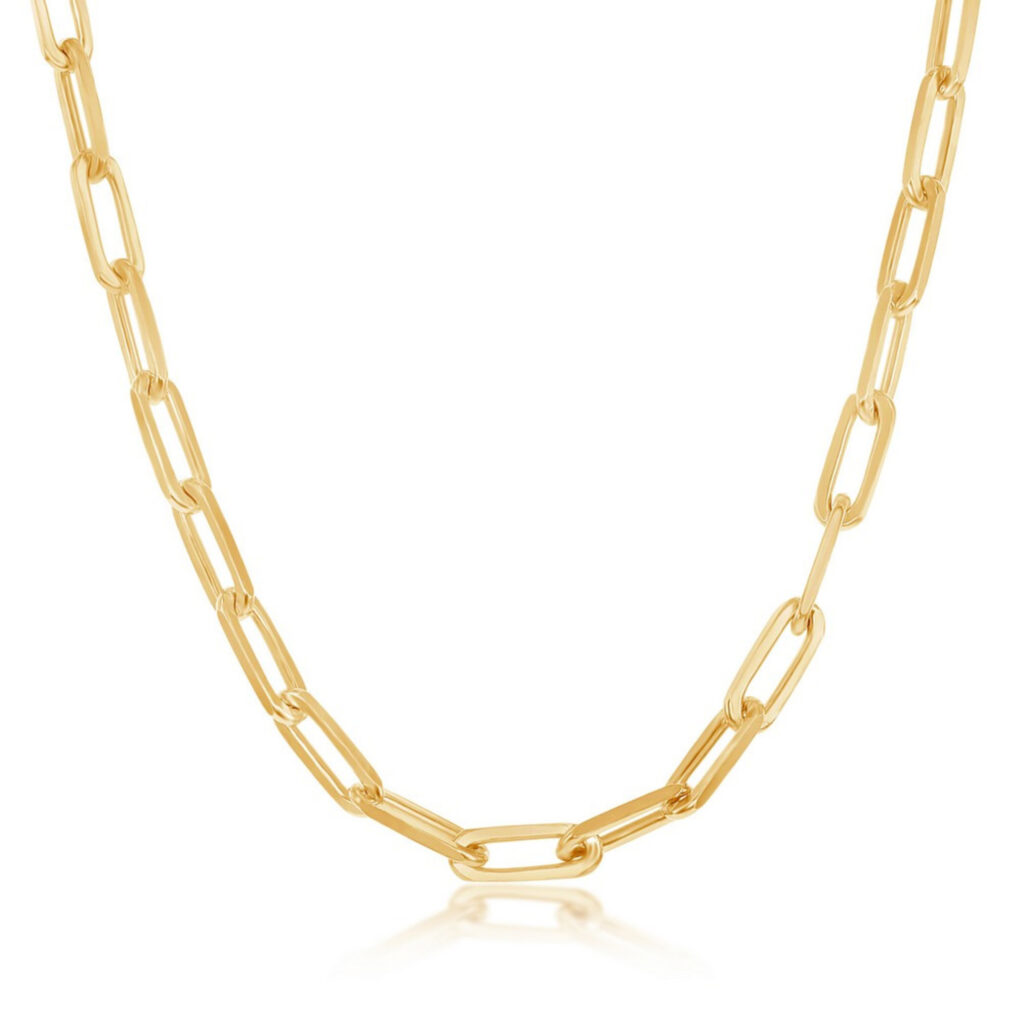 A golden hollow paperclip chain necklace against a white background.