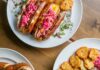 10 Kid-Friendly Restaurants in Pittsburgh Three different plates of food featuring chili dogs, a pretzel, and meat and potatoes at the kid-friendly restaurant Federal Gallery in Pittsburgh.
