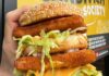 Lent Fish Frys at Restaurants in Pittsburgh A double decker fish sandwich stuffed with lettuce and cheese from the Lent fish fry at Pittsburgh restaurant Pittsburgh Sandwich Society.
