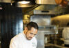 Proust Questionnaire with Chef Fernando Canales Chef Canales adding spices to a plate of food in the fairmont kitchen.