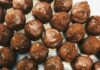 Chocolate, Wine, and Whiskey Festival Comes to Pittsburgh A tray of various, uniform chocolate coated truffles grouped in the center.