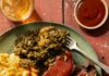A Soulful Taste of the Burgh Festival Features Soul Food in Pittsburgh A green plate holds a rack of ribs, collard greens, and mac and cheese from Cuddy's.