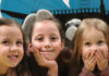 Five Daughters Receive Multiple Therapies at The Children’s Institute three little girls smiling, children's therapy