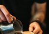 Celebrate National Coffee Day with these 8 Pittsburgh Cafes A pair of white hands pours milk into an espresso. National Coffee Day. Pittsburgh Coffee Shops Pittsburgh Cafes