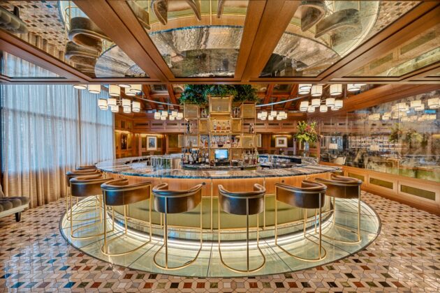 A wide angle of a round bar at Nemacolin with marble surfaces by Armina Stone.