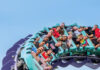 Last Minute Fun Things to Do in Pittsburgh A group of visitors on a rollercoaster at Kennywood, a fun thing to do in Pittsburgh