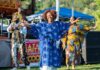 Inclusive Experiences in Pittsburgh A woman dances in a field at the city's Juneteenth celebration.