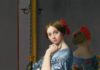 10 Pittsburgh Artworks You Must See in 2024 A painting of a young woman in a blue dress with a red bow in her hair as a park of the Frick Pittsburgh collection.