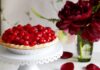 The Sweet Treats of Pittsburgh Two raspberry pies from Pittsburgh sit to the right and back left on a pedestal. A slice of pie sits in front of the pie to the left.