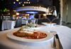 Small Bites with Big Flavors at Rivers Casino Pittsburgh A plate of stuffed banana peppers on a white cover table in a restaurant at Rivers Casino Pittsburgh
