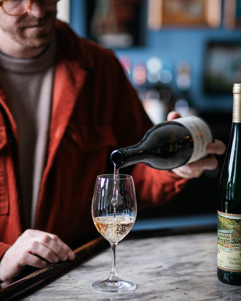 Adam Knoerzer pours a glass of summer wines