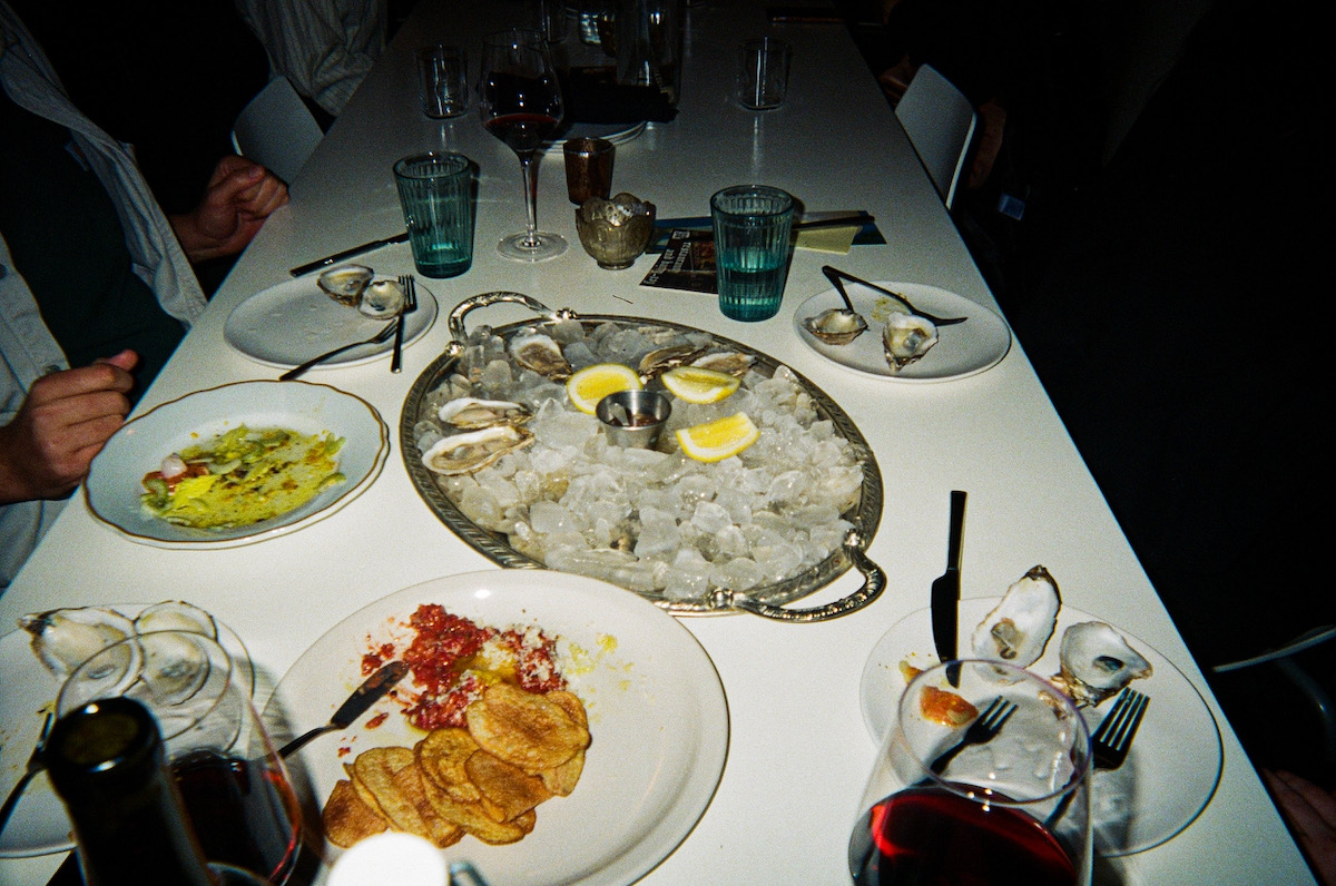 A full table of food from Fet-Fisk, a fine dining restaurant