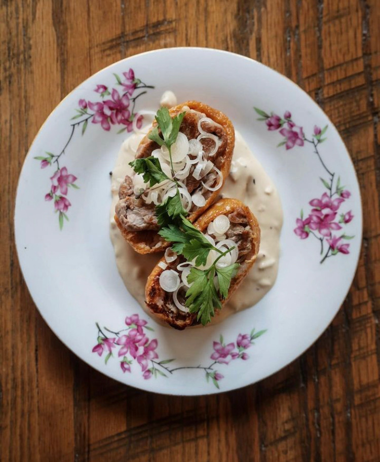 Inari on a white plate on a wooden background