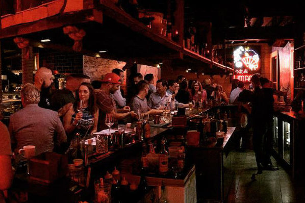 The dimly lit interior of Umami, an izakaya in Pittsburgh that makes for a great date spot 