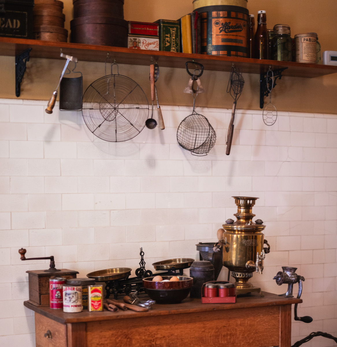 A historic kitchen with Gilded Age artifacts in it 