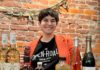The Open Road Non-Alcoholic Retailer Opens in Garfield Owner of the Open Road Mel babitz stands behind a table of non-alcoholic spirits.