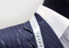 Custom Men’s Clothing in Downtown Pittsburgh Suit tape over the shoulder of a manikin in a blue suit from Larrimors in downtown Pittsburgh.
