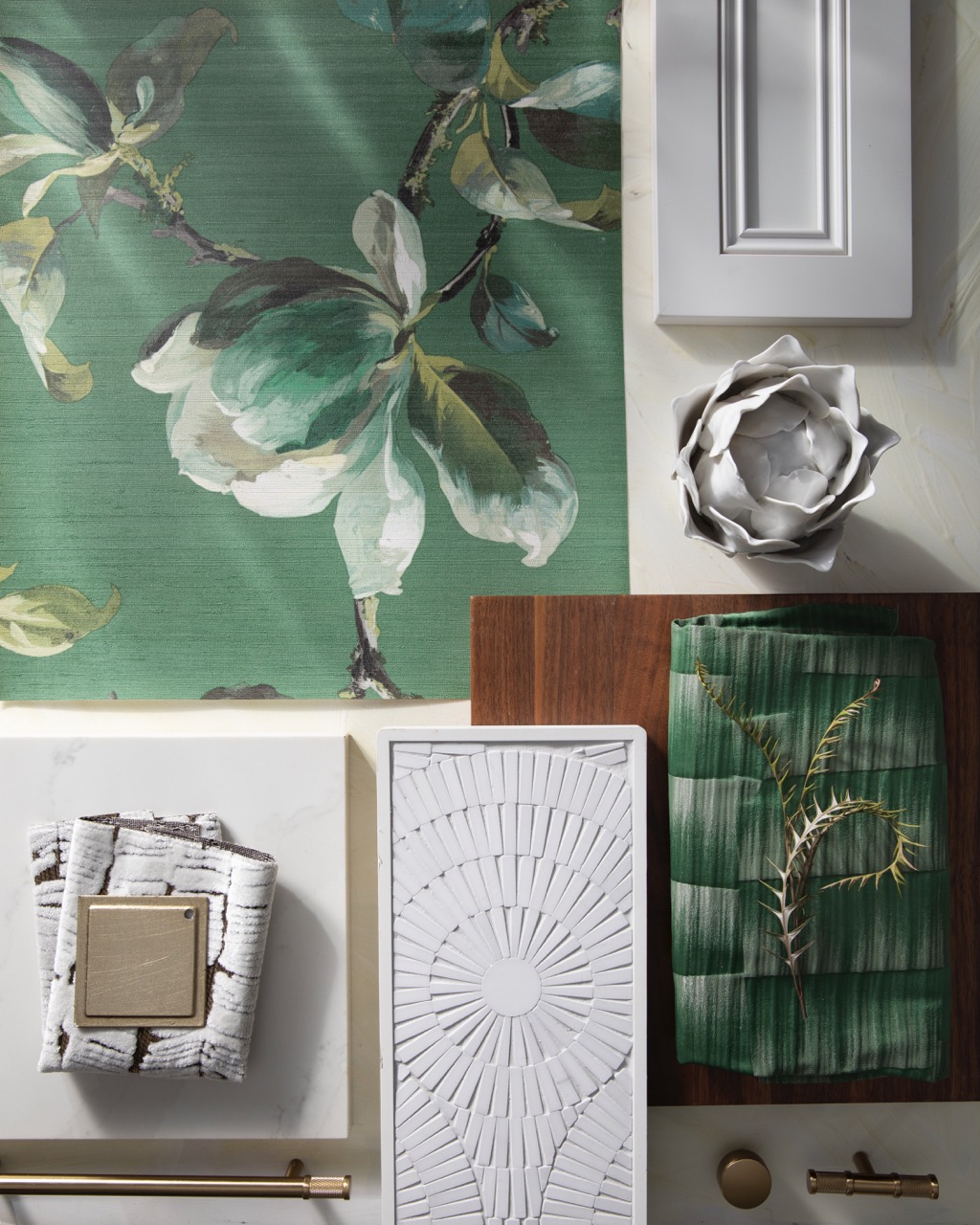 A green flower wallpaper sits amongst matching office supplies also in an emerald green.