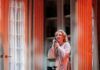 Must-See Fall Pittsburgh Theater Performances A woman on stage holds an old phone to her ear as a man's body lays on the ground in this Pittsburgh theater production.