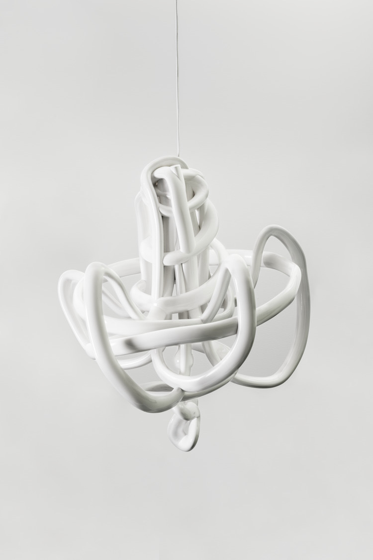 A white chandelier sculpture on a white background