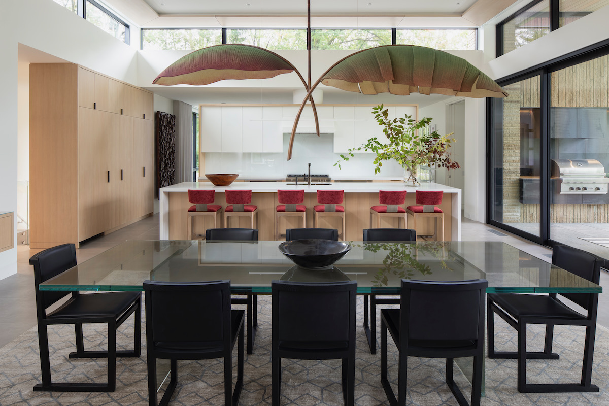 A light fixture over a dining table. 