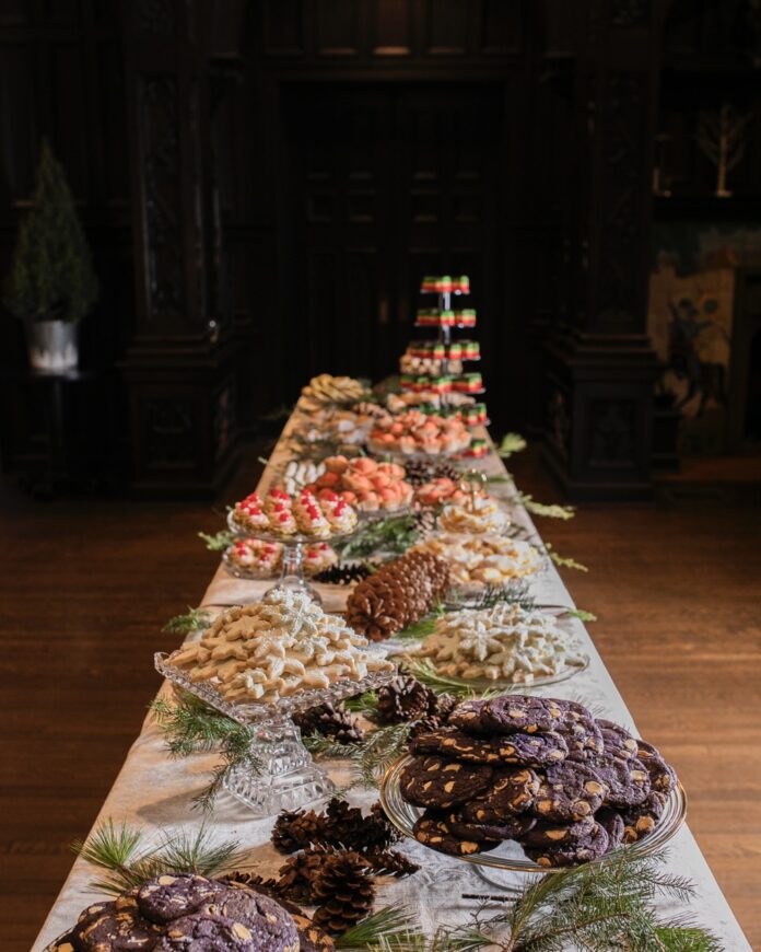Holiday Cookie Recipes From Our Cookie Table Bake-Off A table full of holiday cookies decorated for the winter.
